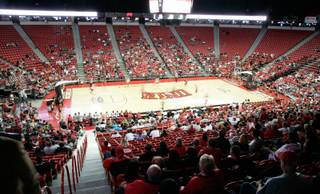 The UNLV basketball team celebrates its first practice with a special event for fans at Thomas & Mack on the campus of UNLV Friday night. 