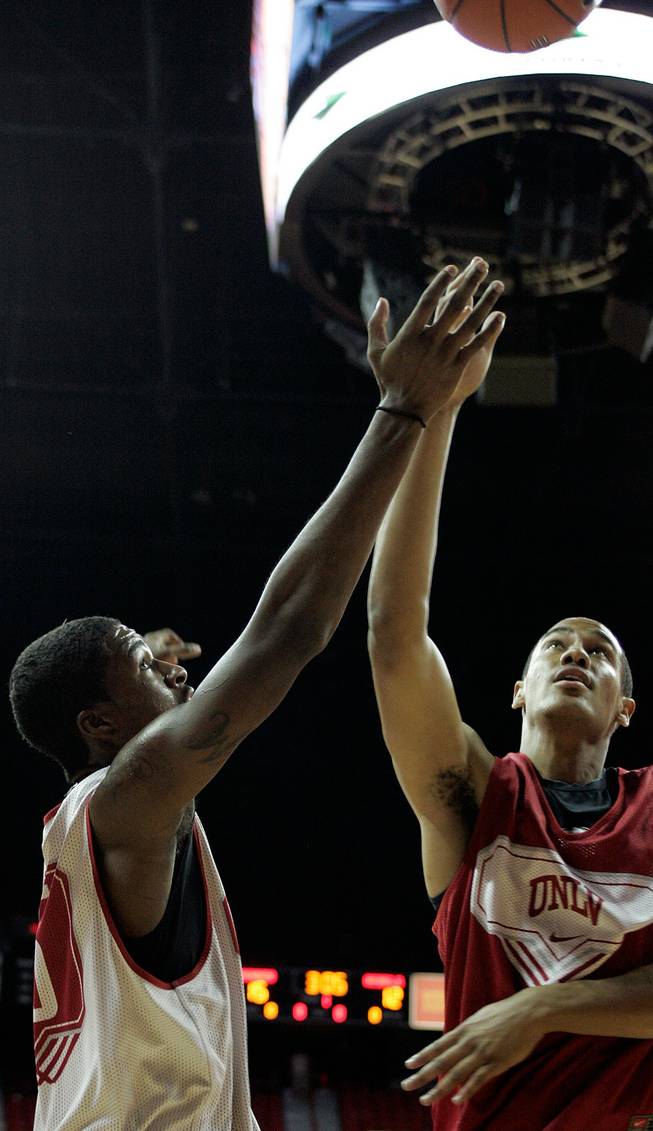 UNLV players Chace Stanback, right, and DeShawn Mitchell fight for a rebound during a scrimmage at the UNLV basketball team's first practice at Thomas & Mack on the campus of UNLV on Friday.

