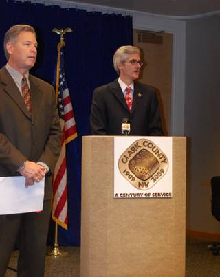 Clark County commission chairman Rory Ried, right, announces the Clark County centennial celebration Wednesday afternoon. Other county commissioners, including Chip Maxfield, left, were at a news conference to make the announcement. 
