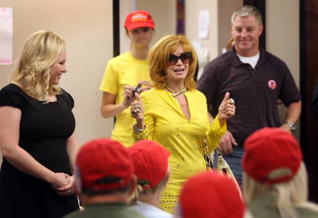 Meghan McCain, left, daughter of Sen. John McCain, visits phone bank volunteers Monday in Henderson, with Linda Ramone, center, and Chuck Heath Jr., Gov. Sarah Palin's brother.
