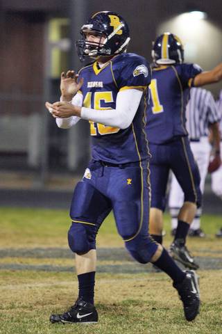 Boulder City defensive end and tail back Matt Causey, cheers his teammates while heading towards the sidelines after completing a play defending Faith Lutheran during a football game against the Crusaders at Boulder City High School.
