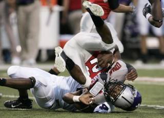 UNLV defensive back Deante Purvis gets up-ended after running back a kickoff during the first half.