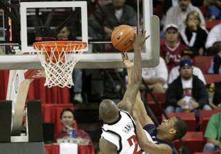 UNLV's Beas Hamga blocks a Washburn shot attempt.