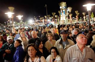 People wait outside the door for the casino to open on the opening night of Aliante Station Hotel and Casino in North Las Vegas Tuesday, Nov. 11, 2008.