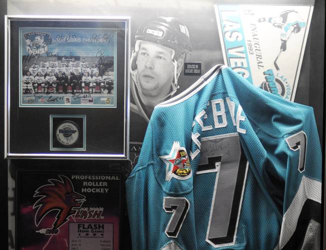 A display highlighting the various minor league hockey teams that have played inside the Thomas & Mack, hangs on a wall in the arena's concourse.