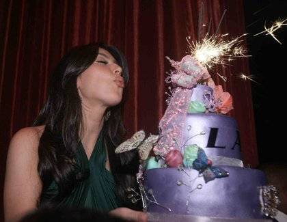 Kim Kardashian, shown celebrating her birthday at LAX, will be at the Palms this weekend.