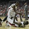 Photo: UNLV guard Wink Adams helps up teammate Beas Hamga Photo: UNLV guard Wink Adams helps up teammate Beas Hamga