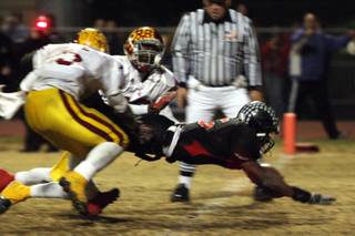 Las Vegas High School running back Raggie Bullock broke a 25-yard touchdown run with 27 seconds remaining in the game to finish off winning the Sunrise Regional title 35-28 against Del Sol at Frank Nails Field on Nov. 21.
