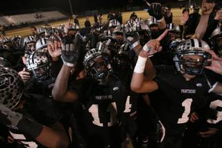 Palo Verde players celebrate their 50-14 Sunset Regional championship victory over Bishop Gorman in 2008.