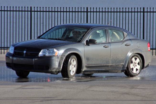 Students who participate in the Driver's Edge program use special practice cars to practice steering and control while skidding.
