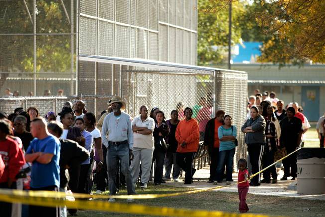 The line stretches around the park's baseball diamond Monday. People began waiting for the food two hours before the giveaway began, and Las Vegas City Council-man Ricki Barlow said turnout dwarfed that of a similar event two years ago.