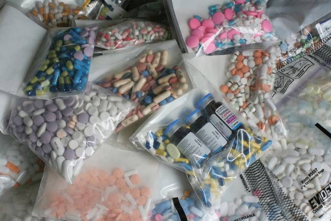 Prescription drugs confiscated by the Clark County Coroner's Office are displayed. School police are warning that more students are abusing prescription drugs.
