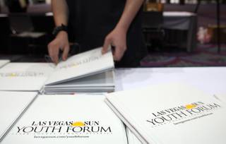 A student picks up supplies at the start of the 2008 Las Vegas Sun Youth Forum at the Las Vegas Convention Center on Tuesday, November 25, 2008.  Approximately 1,000 students from 49 high schools attended the annual event which is sponsored by the Las Vegas Sun and the Clark County School District.