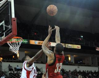 UNLV's Tre'von Willis  goes up for a jump shot Wednesday night as the Rebels take on the Fresno State Bulldogs at the Save Mart Center in Fresno, Calif.