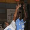 Canyon Springs guard Terrance Stanley looks to shoot over Falcons defender Evan Roquemore during the first half of a game at Foothill High School on Friday.