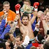 WBC lightweight champion Manny Pacquiao celebrates his victory over Oscar De La Hoya shortly after their welterweight boxing match in Las Vegas on Saturday, Dec. 6, 2008. Pacquiao won by TKO after the end of the eighth round. WBC lightweight champion Manny Pacquiao celebrates his victory over Oscar De La Hoya shortly after their welterweight boxing match in Las Vegas on Saturday, Dec. 6, 2008. Pacquiao won by TKO after the end of the eighth round.
