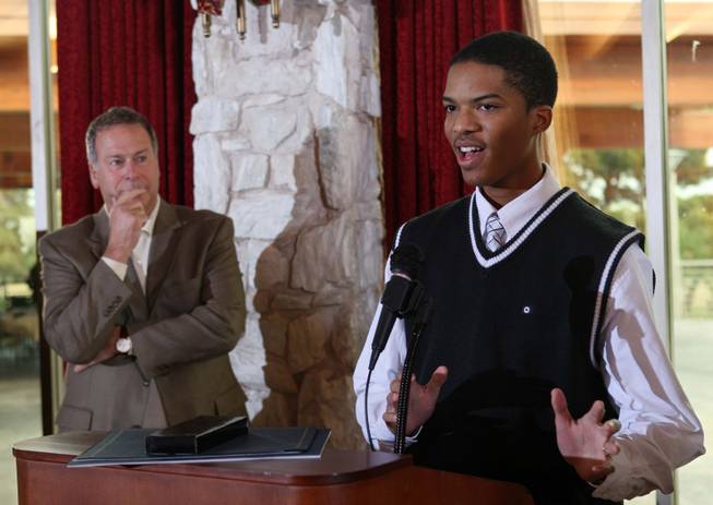 Corey Paris of Shadow Ridge High School speaks during the annual Las Vegas Sun Youth Forum luncheon at the Las Vegas Country Club as Brian Greenspun, president/editor of the Las Vegas Sun, looks on Monday, December 8, 2008.