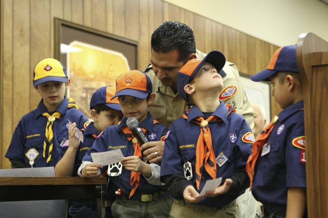 First-grader Dylan Mullins reads suggestions to the City Council to increase public safety by replacing missing fire hydrant markers during the Council Meeting Tuesday. From left: Ryan Brown, 7; Devon Kelman, 6; Dylan Mullins, 6; leader Don Rodriguez; Thomas Brown, 6; and Luke Rodriguez, 6.