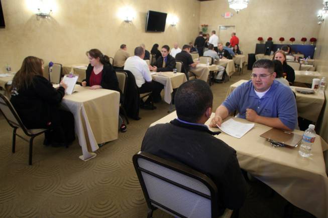 Anthony Ramirez, right, manager of an In-N-Out in Laughlin, conducts an interview. Many of the job seekers said they've put in applications at businesses across the valley, but are having no success.