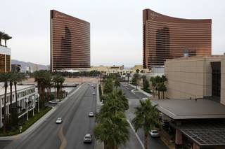 The Encore is shown to the left of the Wynn Las Vegas on the Strip. 