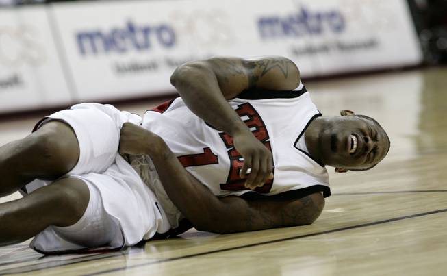 Wink Adams falls to the floor in pain with an abdominal injury Dec. 23 at the Thomas & Mack, where UNLV took on Southern Utah.  UNLV defeated SUU 73-60.
