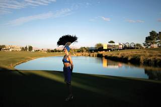 THE WAIT, OCT. 19: Johanna Van Oeveren, a showgirl representing the Las Vegas Convention and Visitors Bureau, waits for photo opportunities with Justin Timberlake and the winner of the Justin Timberlake Shriners Hospitals for Children Open at TPC Summerlin. Sure, I could have gotten that great shot of Timberlake posing with a trophy at the golf tournament, but the lone showgirl standing apart from the rest of the group, seemingly contemplative while waiting for a photo-op, was much more telling.