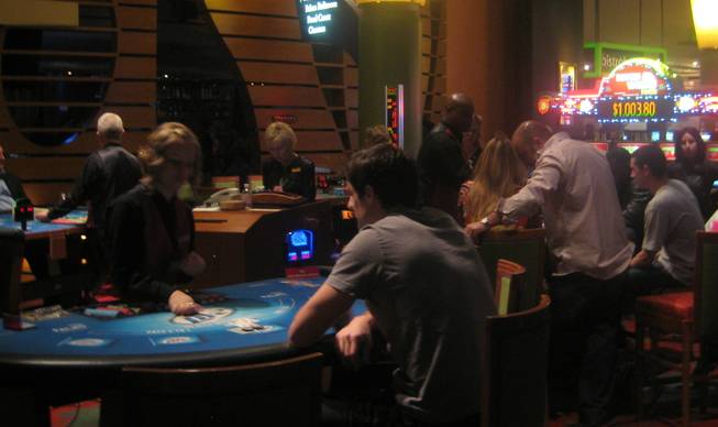 <p>7:30 p.m.: The Palms casino floor was abuzz with bets and bettors on New Year's Eve.</p>
<p>The night got off to a slow start but still managed to finish strong.</p>
<p>The casino floor was surprisingly calm throughout the day and into the early evening. As the clock struck 5 p.m. it was hard to imagine the high-energy parties that were just hours away as gamblers sat quietly and methodically plunked quarters into slot machines.</p>
<p>Two hours later, however, the anticipation was building. Well-dressed crowds of people gathered to play cards and congregating at the craps tables. The casino floor was alive with dice, cards and chips of all colors.</p>