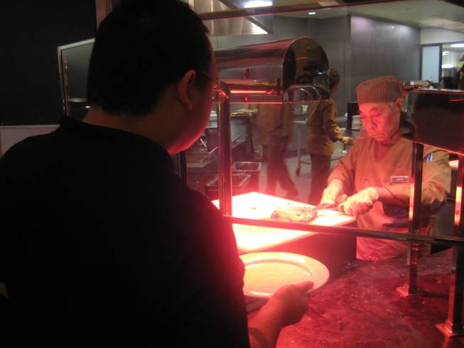 <p>8 p.m.: People lined up on Dec. 31 to get their fill of New Year's Eve eats at the Palms' Bistro Buffet.</p>
<p>Las Vegas residents Octaviano and Agenlica Moreno brought their daughter, Giselle, to the buffet for a special New Year's Eve dinner. While the family wasn't planning on staying at the Palms until the clock struck 12, Giselle didn't seem to mind. The youngster was all smiles and cute as can be as she tucked into a slice of chocolate cake while wearing a cute party dress and "happy new year" tiara.</p>