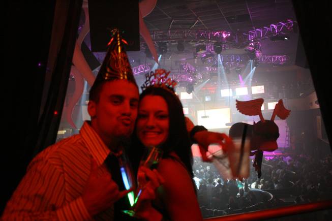 <p>11:55 p.m.: Kale Durocher, left, and Cassi Carington, right, came to Las Vegas from sun-drenched Hawaii to celebrate New Year's Eve together at Rain. Both said they are "huge" fans of Perfecto DJ Paul Oakenfold.</p>
<p>"It was a surprise Christmas present for me to come to Vegas," Carington said. "(And) he loved Paul Oakenfold so I said let's go."</p>