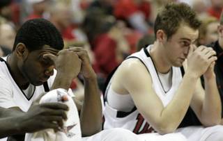 Darris Santee and Kendall Wallace can't bear to watch as UNLV shot two-of-seven at the free throw line in the last 38 seconds. The Rebels still managed to beat the Lobos, 60-58.