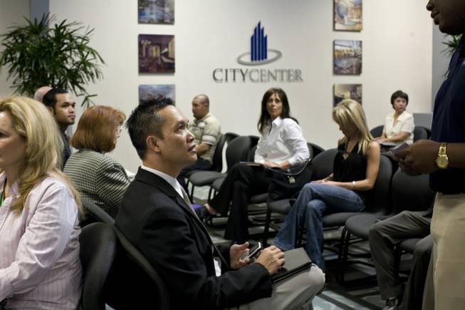 Romeo Cornista, left, talks with CityCenter career adviser Marcus Green while waiting for his turn at the job center. Because MGM Mirage is highlighting the project's hospitality and service, only about 1,800, or fewer than 15 percent, of the jobs will be gaming-related.