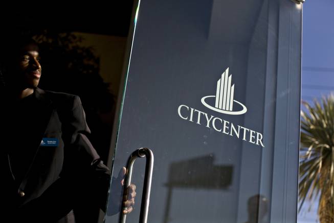 Security officer Brandon Dew greets job seekers Monday. As part of CityCenter's sales pitch to job candidates, greeters are supposed to be as enthusiastic as the applicants, to show the resort is different.