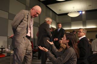 Nevada State College student Dana Gorham asks NSC President Fred Maryanski why he and other college presidents didn't stop the underfunding of higher education during a Monday town hall meeting at UNLV.