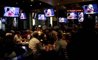 Super Bowl fans gather at ESPN Zone on the Las Vegas Strip to watch the game Sunday as the Arizona Cardinals took on the Pittsburgh Steelers. Seating was limited to about 450 people. 