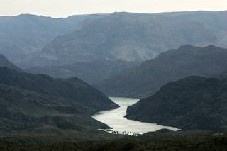 The Colorado River winds its way past Lake Mead's Willow Beach in Arizona. The beach, 14 miles south of Hoover Dam on the Arizona side of the Colorado River, is set to get a $20 million upgrade. The revamped beach area will include a state-of-the-art RV campground, picnicking area, camping area and nature trail. The area is scheduled be ready for use in late 2010.