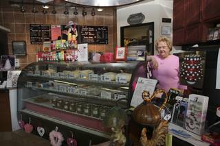 Laid-off employee Sharon Pritchard volunteers her time 10 hours a week to work behind the counter of Cheesecake and Crime, a mystery book shop and cheesecake joint, due to her dedication to her employers, Pam and Lendall Mains.