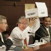 State Sen. Bob Coffin, D-Las Vegas, presents a box Tuesday that he said held tax suggestions he's received as the new tax committee chairman.