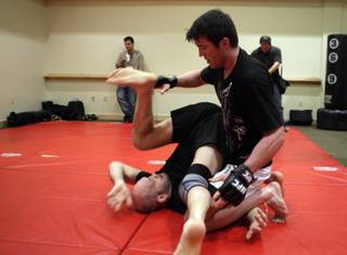 Middleweight fighter Chael Sonnen works out with Matt Lindland at the Mandalay Bay Events Center Wednesday, February 3, 2010. Sonnen will fight Nate Marquardt in UFC 109 at the events center on Saturday.
