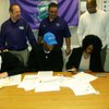 Silverado safety Michael Wadsworth, front left, and defensive end Keenan
Graham, front center, sign their national letters of intent on Wednesday, Feb. 4, 2009.
Graham inked with UCLA and Wadsworth picked Hawaii. Also pictured are
Graham's mother, Jacqueline Maharaj, at bottom right, Silverado Athletic
Administrator Jerry Cornell (back left), Silverado football coach Andy
Ostolaza (back center) and Silverado basketball coach Ron Childress (back
right).