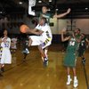 Durango guard Devonte Williams goes airborne to score on a reverse layup inside Mojave's Anthony Marshall during the Sunset Regional Quarterfinals on Tuesday. Durango guard Devonte Williams goes airborne to score on a reverse layup inside Mojave's Anthony Marshall during the Sunset Regional Quarterfinals on Tuesday.
