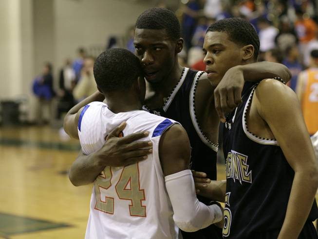 Elijah Johnson and Demtric Williams of Cheyenne fight back the tears as they congratulate John Loyd after the game as Bishop Gorman and Cheyenne faced off in the Sunset Regional semifinals at Palo Verde High School in Las Vegas Thursday night. Bishop Gorman pulled out a victory over Cheyenne 70-68.