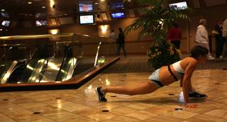 Laurie Black from Brooklyn, New York stretches before her climb time at the Scale the Strat event on Friday.  111 participants hustled up the Stratosphere to raise money for the American Lung Association of Southern Nevada. Participants climbed 1,455 stairs and 108 stories to the observation deck.