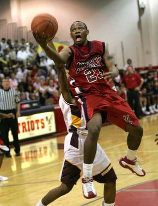 Liberty's Kenneth Peters (23) goes for a basket against Eldorado during the Sunrise Regional Finals at Liberty Friday.
