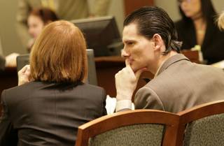 Chester A. Stiles confers with his attorney, public defender Stacey Roundtree, as testimony continues in his trial. Stiles faces 22 charges in connection with the sexual assaults of two young girls. Jurors heard opening arguments and testimony from one of his alleged victims and her mother on Monday. 