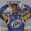 Kurt Busch adjusts his cap as he poses for photographers after taking the pole at the Las Vegas Motor Speedway on Friday, Feb. 26, 2010.