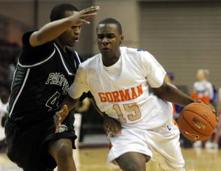 Bishop Gorman's Shabazz Muhammad (15) drives against Palo Verde's Delron Mims during the 4A boys' state championship at the Orleans Arena on Friday night.