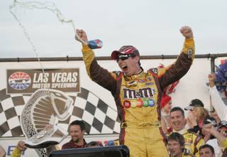 Kyle Busch celebrates winning the Shelby 427 NASCAR Sprint Cup Series race on Sunday.