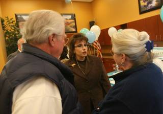 North Las Vegas mayoral candidate Stephanie Smith, center, talks with Avis Ericson Adams, right, and Allan Adams during a meeting with Sun City Aliante residents at the Sun City Aliante community center Tuesday.