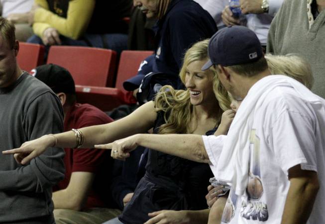 Sarah Cummard, wife of BYU star guard Lee Cummard, points during second half action of the Cougars' 80-69 semifinal victory over Air Force earlier this year in the Mountain West Conference tournament semifinals. Cummard made the trip to Vegas to support her husband despite an alleged incident between her and some UNLV fans during last year's tournament title game.