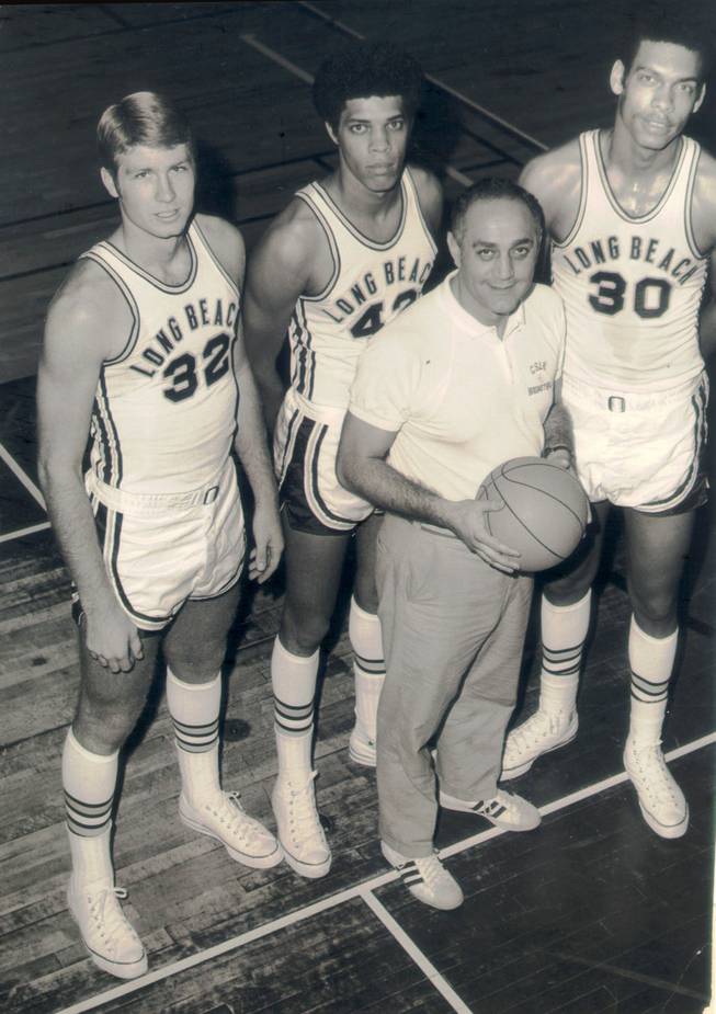 
Coach Jerry Tarkanian poses with members of his Long Beach State 49ers team, from left, Chuck Terry, Ed Ratleff and George Trapp. 